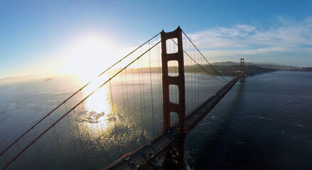 Golden Gate bridge with traffic during sunset. Aerial view
