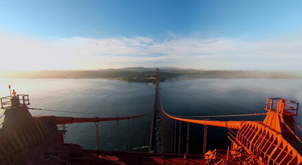 Top of Golden Gate bridge at autumn evening during sunset. Aerial view