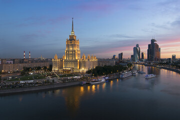 Stalin skyscraper - Ukraine Hotel near Moskva river during sunset in Moscow