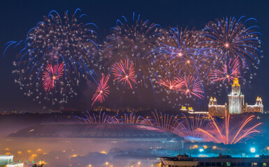 Bright fireworks explosions in night sky above Luzhniki stadium in Moscow