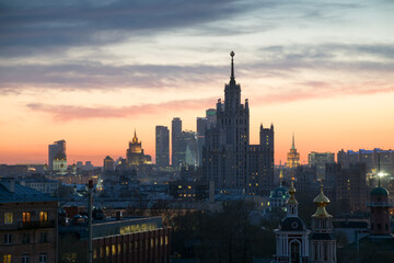 Fototapeta na wymiar Panorama of churches, Stalin skyscraper and skyscrapers at sunset in Moscow, Russia