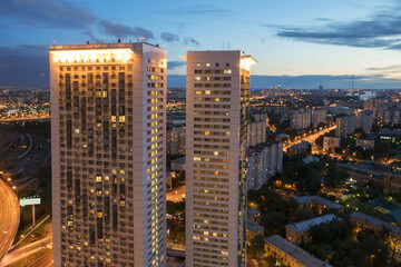  Buildings on Begovaya street at night, twin 38-storey towers - is part of largest residential...