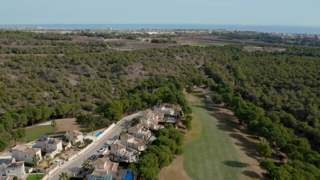 Above, drone point of view Las Ramblas golf club with modern villas and apartments on Costa Blanca, Alicante. Sport and recreation tourism concept