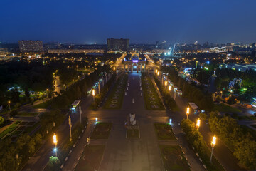 Obraz premium Beautiful walkway with lanterns, arch in VDNKh at night in Moscow, Russia