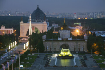 Beautiful Fountain with illumination, pavilions, rocket in VDNKh at night in Moscow, Russia