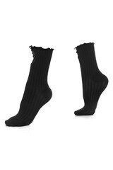Close-up shot of a pair of black women's socks decorated with a bow and pearl beads. Fashionable high patterned socks are isolated on a white background. Side view.