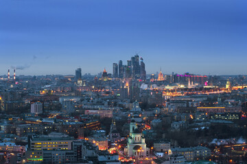 Fototapeta na wymiar Panoramic view of Moscow City business complex, Stalin skyscrapers, residential buildings and churches at evening in Moscow, Russia