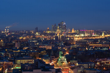 Obraz premium Panoramic view of Moscow City business complex, Stalin skyscrapers, residential buildings and churches at night in Moscow, Russia