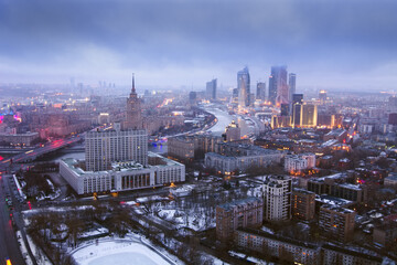  Hotel Ukraine, Moskva river, White House and Moscow City business complex at night in Moscow,...