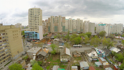City slums among tall dwelling houses at spring day. Aerial view video frame - obrazy, fototapety, plakaty