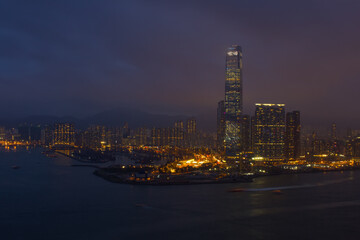 Fototapeta na wymiar One Island East Centre on coast in business area at night in Hong Kong, China, view from China Merchants Tower