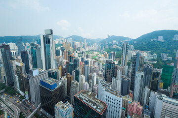 Skyscrapers, buildings, mountains in Hong Kong city, China at summer, view from from China Resources Building - obrazy, fototapety, plakaty