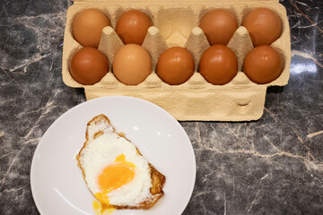 Packing chicken eggs in a tray, one egg missing