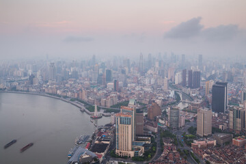 River and Shanghai city in fog at early morning, view from White Magnolia Plaza