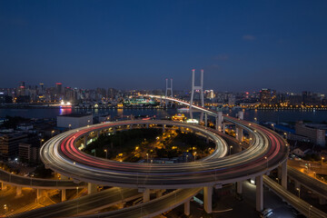 Huangpu Bridge and large transport interchange with illumination at dark night