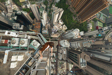 High skyscrapers, buildings roofs and roofer in Hong Kong city, China, aerial view from Manulife Plaza