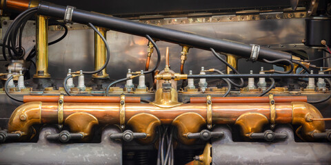 Side view of the engine of an early twentieth century British luxury car