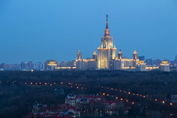 Selbstklebende Fototapeten Moscow State University, Guest houses of Federal Security Service in foreground at night in Moscow, Russia © Pavel Losevsky