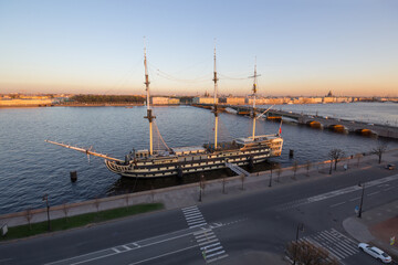 Palace Bridge, Neva river and frigate Grace at evening in St. Petersburg, Russia
