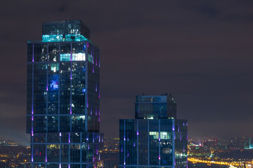  Top of buildings in Moscow International Business Center at night. Years of construction of...