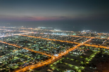 Sawta area with illumination and sea far away in resort Dubai, UAE at night