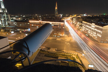Outdoor Security Camera and night street in Moscow, long exposure, focus on camera
