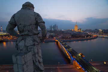 Smolensky Metro Bridge and sculpture on rooftopon building (Smolenskaya Embankment 2a was built in...
