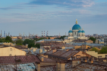 Blue domes of Trinity Cathedral and rusty roofs in Saint Petersburg, Russia
