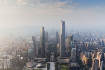 Fototapeta na wymiar Guangzhou city in fog at sunny morning at summer day, aerial view, China