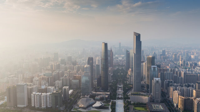 Guangzhou city panorama in fog during sunrise, China, aerial view