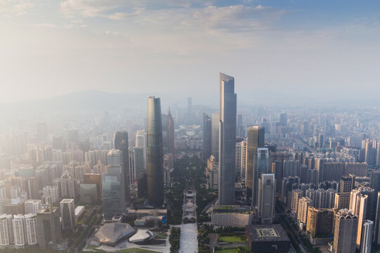 Guangzhou city in fog at sunny morning at summer day, aerial view, China