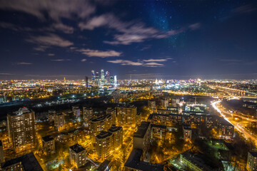 Fototapeta na wymiar Night view of residential district with illumiantion and starry sky in Moscow, Russia