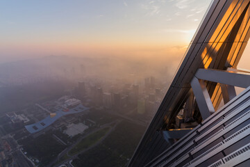 Fototapeta na wymiar Rooftop of high skyscraper and evening cityscape, Shenzhen, China