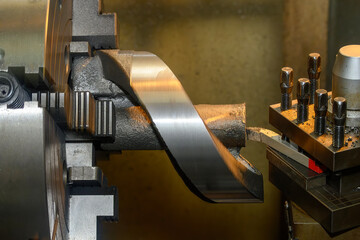 The lathe machine finish cutting the cast iron parts.