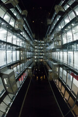 Obraz premium Beautiful illuminated windows with relfection in glass - modern building, fisheye