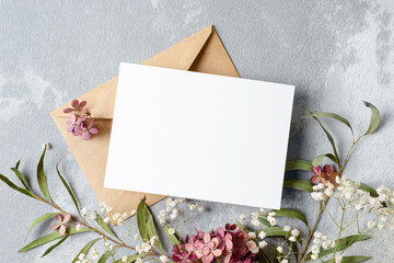 Wedding invitation card mockup with envelope and trendy flowers decor