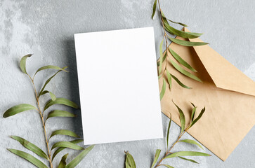 Blank paper invitation card mockup with botanical decor, white card mock up with copy space