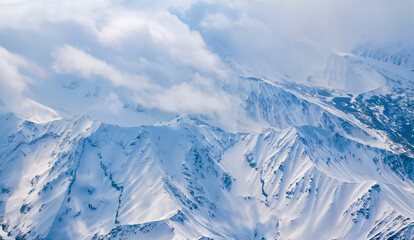 Fly Over Denali Mountain Snow Covered Peaks in Alaska