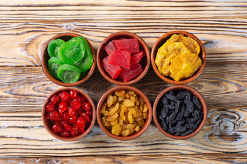 Group of dried and candied fruit in bowl - 755759825