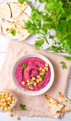 Beetroot hummus on white table, top view