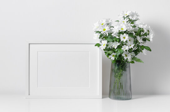 White landscape frame mockup with big flowers bouquet.