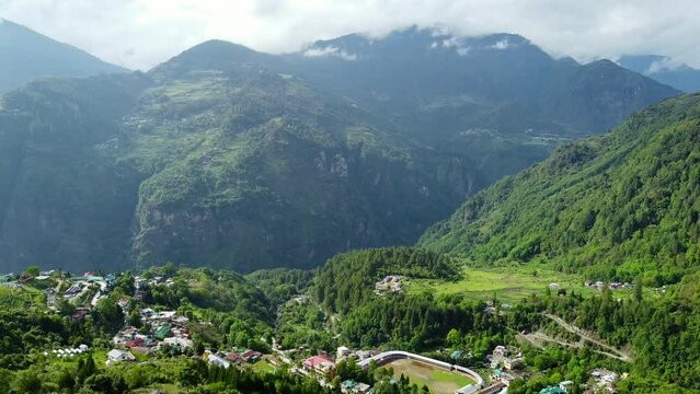 Jang town deep in the  jang valley in tawang district of arunachal pradesh and surrounded by high mountains on a bright morning, western arunachal pradesh in India.
