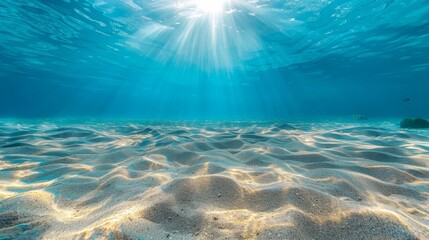 Seabed sand with blue tropical ocean above and sunny blue sky