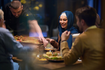 In a heartwarming scene, a professional chef serves an European Muslim family their iftar meal...