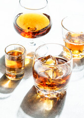 Strong alcohol drink. Cognac, whisky, rum, tequila at white background.