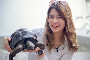 Aldabra Giant Tortoise with Beautiful Young Woman