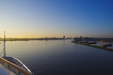 Modern cruiseship cruise ship liner arrival in to Amsterdam, Holland port through North Sea Canal...