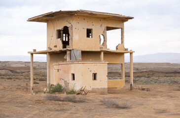 An abandoned building with bullet marks next to Qasr el Yahud on the Jordan River. Israel - 755790632