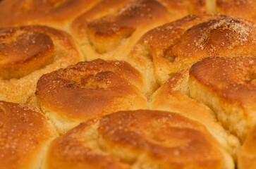 freshly made tray of cinnamon rolls, macro food background