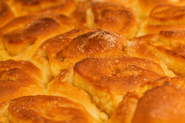 freshly made tray of cinnamon rolls, macro food background
